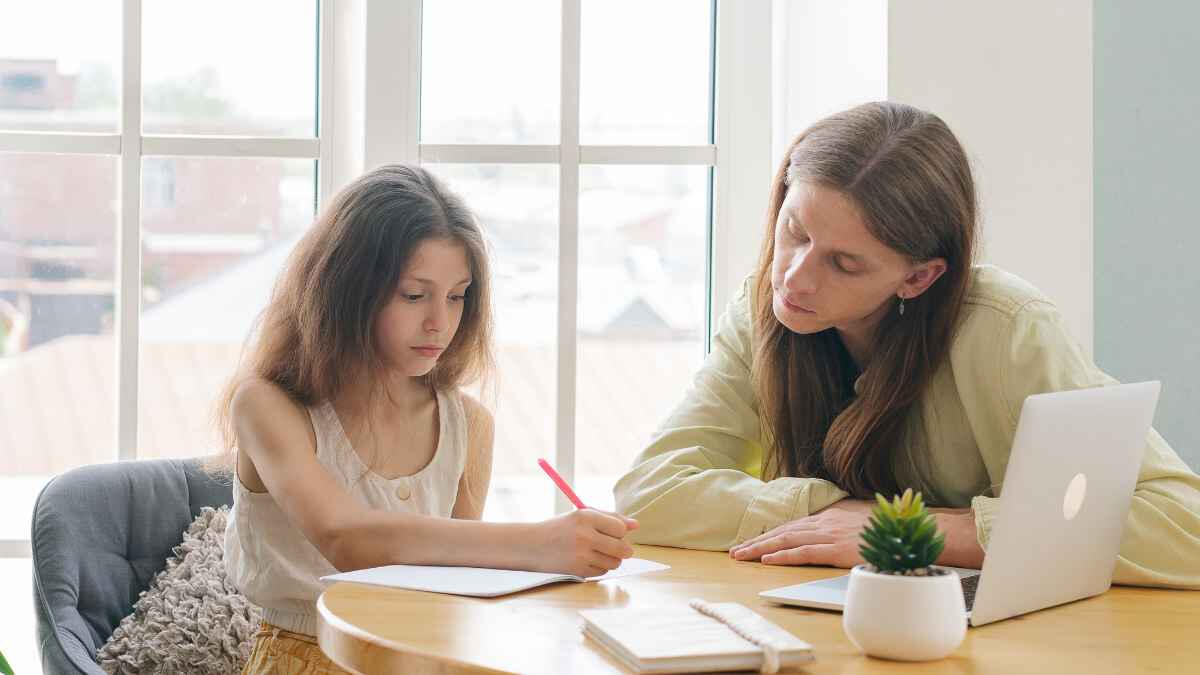 Tutor teaching kid Tutor teaching kid